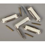 Four Richards folding pen knives with pen function.