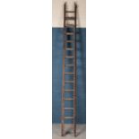 A set of A.Bratt & Sons wooden ladders.