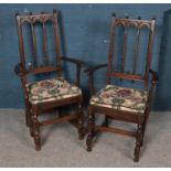 A pair of carved Ercol armchairs.