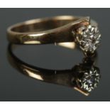A 9ct Gold and single stone diamond ring. Size KÂ½. Total weight: 2.16g