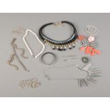 A quantity of assorted costume jewellery including one silver bracelet, necklaces and earrings.