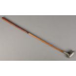 An antique Harry C Lee Schenectady putter with hickory shaft. Dated March 24 1903.