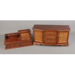 Two decorative carved wooden jewellery boxes. Larger example featuring bergere detail on doors.