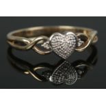 A 9ct Gold and Diamond heart ring. Size P. Total weight: 1.64g.