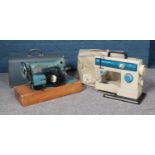 An Alfa Challenge sewing machine with case and peddle and Frista Dressmaker with cover, peddle and