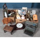 Three boxes of miscellaneous. Includes Olympia typewriter, mantel clocks, carved wooden stool,