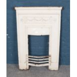 A painted cast iron fire plate. Dimensions 60cm x 97cm.