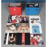 Two carry cases containing an assortment of single and album vinyl records. To include Wet Wet