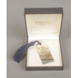 A boxed silver bookmark with blue tassel. Hallmarked Sheffield 2008.