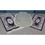 A Jalna green ground rug along with two floral decorated blue ground runners.