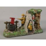 A novelty cast iron money box 'Boy Scout Camp'.