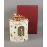 A Villeroy & Boch jar with music box in the form of a Christmas present decorated with ribbon and