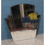 An Art Deco style mirror. Dimensions 71cm x 71cm (at widest point).