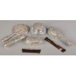 A collection of 1970s filled silver and silver mounted dressing table items by W I Broadway & Co.