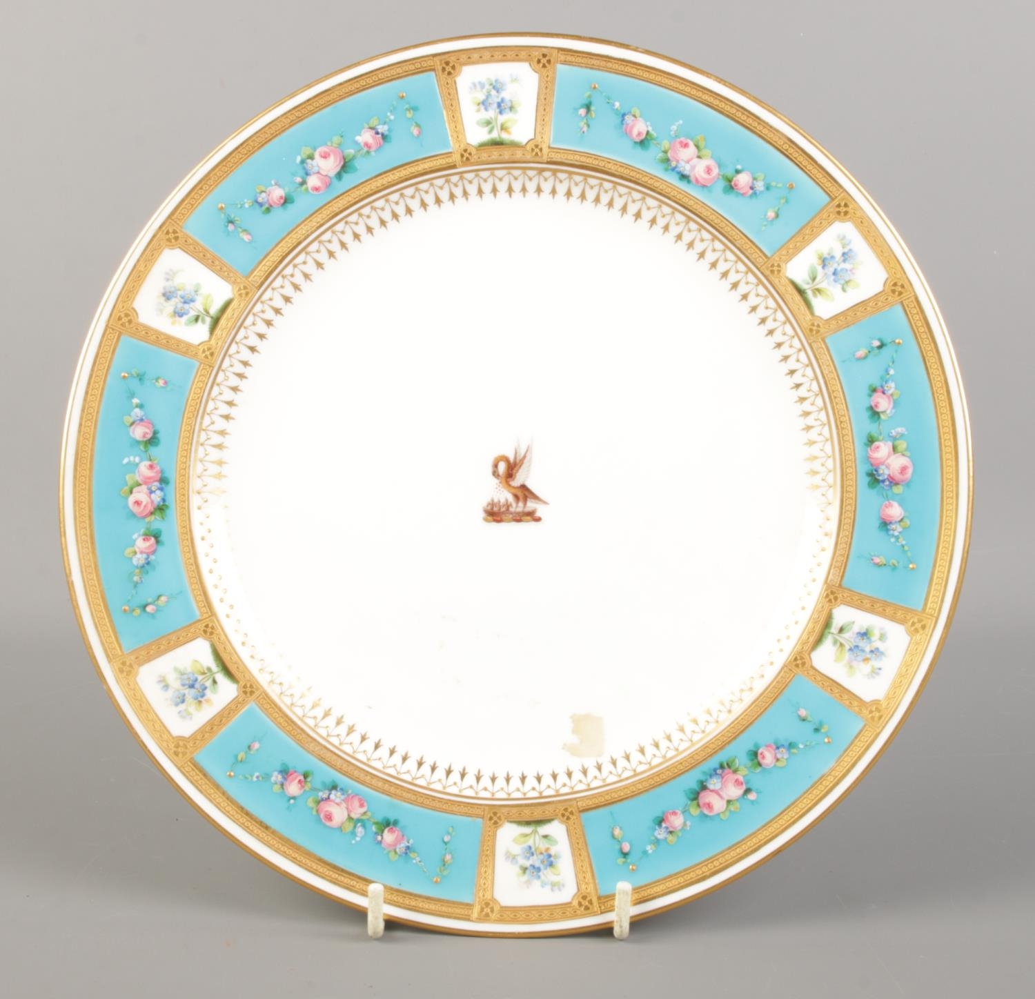 A late 19th century Minton porcelain plate with gilt and turquoise border decorated with hand