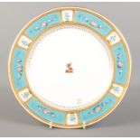 A late 19th century Minton porcelain plate with gilt and turquoise border decorated with hand