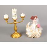 A pair of Disney's Beauty & The Beast figures including Wedding Day Belle and Large Lumiere.