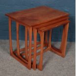 A set of three GPlan style teak nesting tables. Largest table dimensions 56.5cm x 41cm x 51cm.