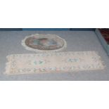 Two floral rugs with decorative fringe. Includes oval and rectangular example.