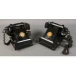 Two vintage hand crank telephones.