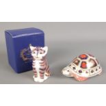 Two Royal Crown Derby paperweights. One formed as a cat and the other a turtle.