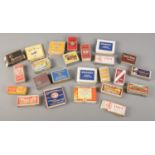 A collection of vintage dummy cigarette and tobacco packets.