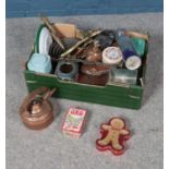 A box of miscellaneous including collectable tins such as Oxo, a copper pan set and ceramic plates