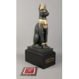 A Franklin Mint black porcelain figure on titled plinth - 'Guardian of the Nile', with