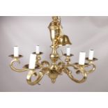 A heavy brass six branch chandelier. Height 53cm, Width 66cm. Approximately 10kg.