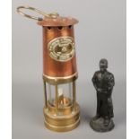 A E.Thomas & Williams Ltd Cambrian copper and brass miners lamp along with a Kingmaker coal figure