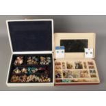 Two large boxes of vintage earrings contained withing jewellery boxes.