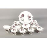 A Royal Albert china tea set featuring rose pattern. Approx. 23 pieces including tea cups and