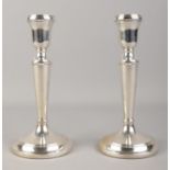 A pair of silver filled candlesticks, assayed for Birmingham, 1997 by John Bull Ltd. Height: 19cm.