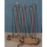 A quantity of vintage golf clubs. Including W H Wooler, etc.
