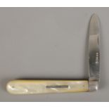 A large Victorian silver bladed and mother of pearl fruit knife with monogrammed bar insert