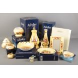 A quantity of mostly boxed Aynsley Orchard Gold ceramics. Including table lamp, photo frame, vase,