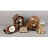 A quantity of assorted clocks including Enfield mantel and torsion example.