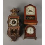 A Dutch wall clock featuring figure of Atlas with German eight day movement. Also two mantle clocks.