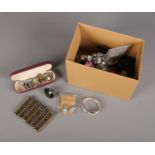 A box of assorted costume jewellery to include bracelets, necklaces, earrings etc.