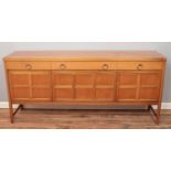 A Nathan teak sideboard with four drawers over panelled cupboard doors. Height 84cm, Length 183cm,