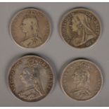Four Victorian silver coins. Including double florin and three half crowns. 63.92g.