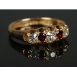 A Victorian 18ct Gold five stone garnet and diamond ring. Assayed for Chester, 1881. Diamonds old