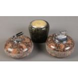 Three polished stone collectables. Includes curling stone paperweight, table lighter and a