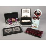 A large collection of mainly costume jewellery, contained within jewellery boxes. To include