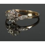 A boxed 9ct diamond cluster ring. Size P 1.32g.