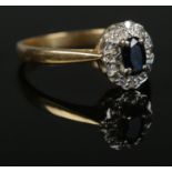 An 18ct Gold, Sapphire and Diamond cluster ring. Size N. Total weight: 3.72g