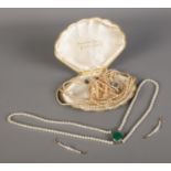 A collection of simulated pearls to include necklaces and hoop earrings.