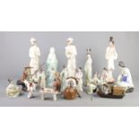A large quantity of ceramic and composite oriental figures. To include fishing and figures playing