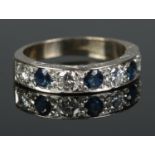 An 18ct Gold Sapphire and Diamond half eternity ring. Each diamond Â¼ct. Size Q. Total weight: 5.20g