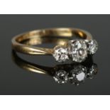 An 18ct Gold and Platinum three stone diamond ring, with central oval cut stone being over Â¼ct.